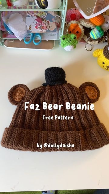 a knitted bear beanie sitting on top of a table