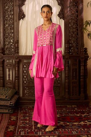 Hot pink tunic featuring thread, zari embroidery on the front yoke highlighted with sequin, gota and ghungroo detailing. Paired with a bell bottom pant. - Aza Fashions Festive Pink Kurta With Sequins, Pink Sequined Straight Kurta Set, Pink Sequined Kurta For Festivals, Festive Pink Tunic, Tunic With Pants, Pink Thread, Zari Embroidery, Pant Women, Women Kurta