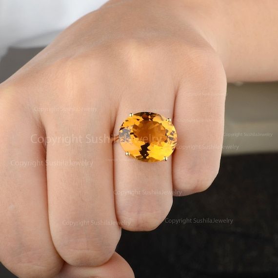 Large Oval Yellow Citrine Gemstone Statement Engagement Ring Solid 14K Yellow Gold Handmade Bridal Jewelry November Birthstone Ring≫ Features• Items Code: SR01422• Metal: 14K Solid Gold (18K also available - Additional• Citrine Weight :-  7.5 Ct.• More option in gold color: Rose Gold, Yellow Gold, White Gold• Ring Size :- 3 to 10 ( All Size Avaialble )≫ FAQ below for more detail.✦ Sizing .....................We can adjust most items to fit your sizing preferences. Most items can be made to any s Statement Engagement Ring, November Birthstone Ring, Anniversary Jewelry, Yellow Citrine, November Birthstone, Citrine Gemstone, Aquamarine Gemstone, Diamond Solitaire Rings, White Gold Ring