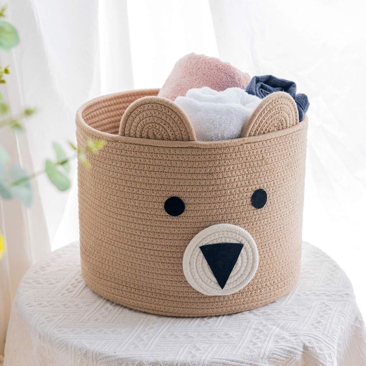 a basket with a bear face on it