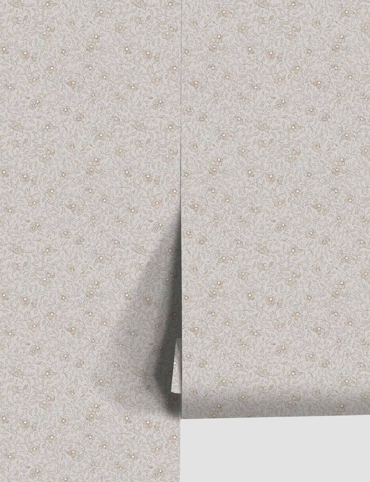 the wall paper is white and has a pattern on it