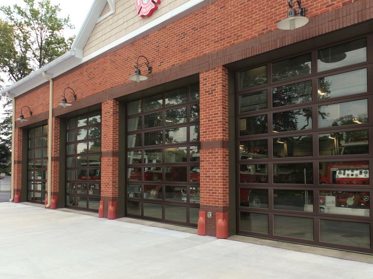 a brick building with two large garage doors