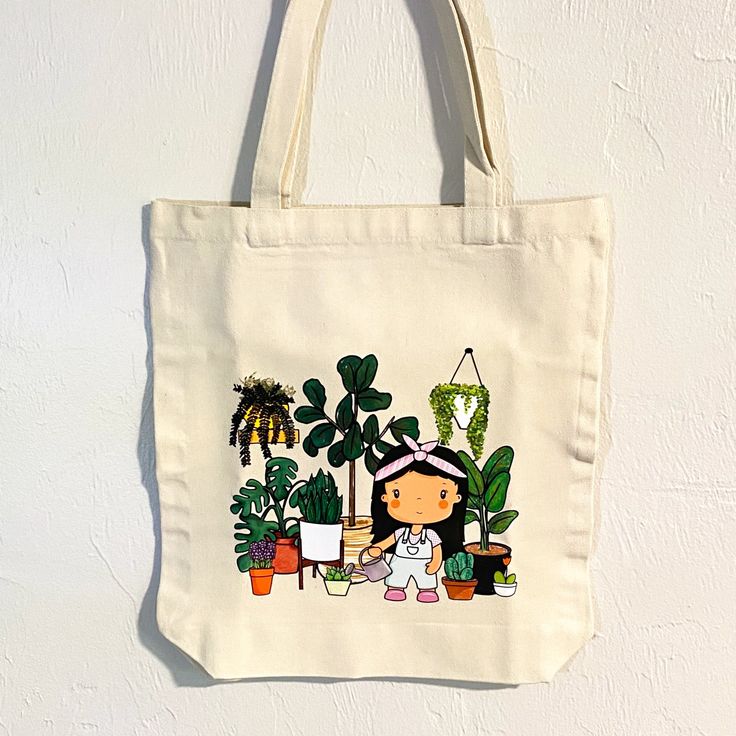 This stylish tote bag is perfect for the plant lover, home gardener, or anyone who wants to show off their love for nature. It is made of 100% cotton and features a cute design. Its roomy size is perfect for carrying groceries, books, and other everyday items. This tote bag is perfect for back to school, the beach or for your groceries. Get it before it's gone! Approximate measurements: Width 15" Length 16" Material: 100% cotton canvas Colors might look different in your screen. Follow me @Jolli Botanical Style Rectangular Cotton Canvas Bag, Botanical Cotton Canvas Tote Bag, Botanical Cotton Canvas Bag For Everyday Use, Botanical Cotton Canvas Bag For Daily Use, Botanical Cotton Tote Bag, Botanical Style Cotton Tote Bag, Botanical Cotton Canvas Gift Bag, Cotton Tote Bag With Plant Print, Cute Cotton Canvas Bag For Everyday