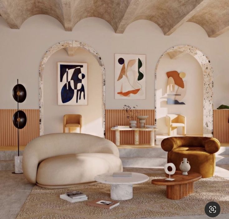 a living room filled with furniture and art on the walls