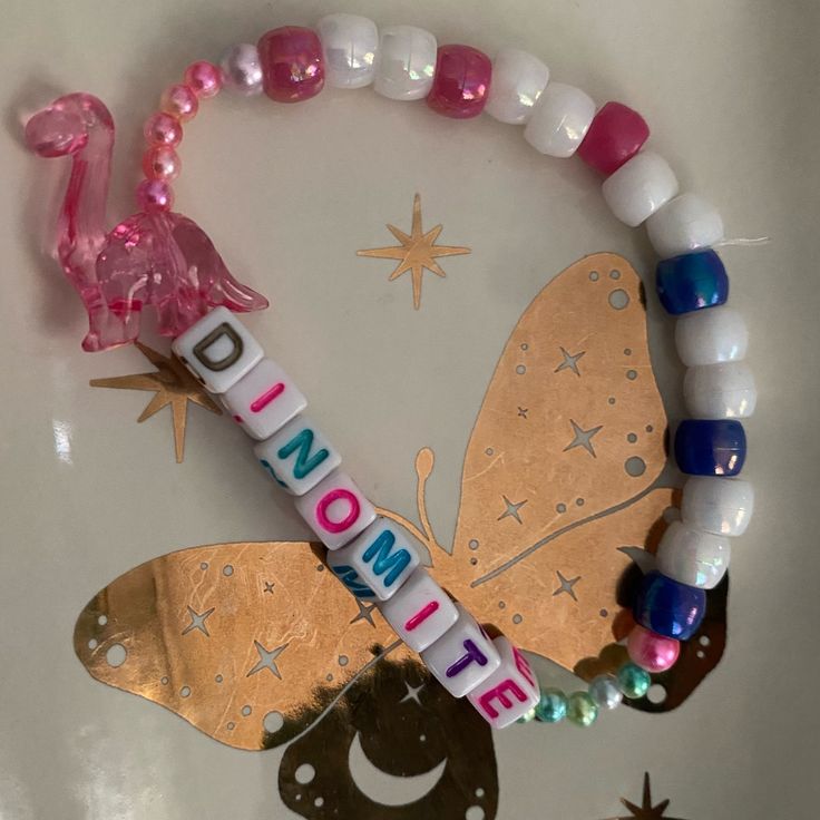 Brand New. One Of A Kind. Has A Pink Dinosaur With Beads That Sparkle Different Colors In The Light. Great For Edm, Plur, Rave, Plur, Vsco, Y2k, Kawaii, Positivity, Zen, Yoga, Meditation, Affirmations, Ocean, Nautical, Beach, Journey, Growth, Healing, Spiritual, Self Love, Self Care, Hippie, Gypsy, Boho, Bohemian, Hippie, Gypsy, Animal, Iridescent, Colorful, Bright, Nature, Ab Kandy Braclets, Kawaii Positivity, Kandi Patterns Cuff, Spiritual Self Love, Rave Core, Dinosaur Bracelet, Rave Kandi Ideas, Kandi Jewelry, Kandi Inspiration