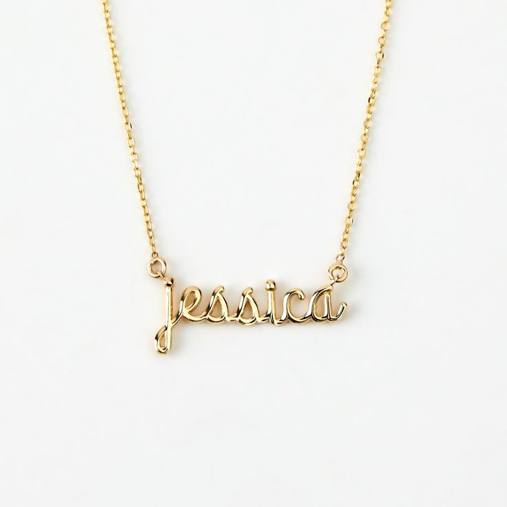 Script Name 14K Gold Necklace Adorn yourself with this 14K Gold Script Name Necklace, a perfect blend of personalization and style. Customizable for women, it's more than just a piece of jewelry; it's a statement of identity. This dainty 14k yellow gold necklace, makes an excellent personalized gift, elevating your elegance and charm. With its timeless design, it's a valuable addition to your jewelry collection, enhancing your style and personality. You'll have: 14k solid gold handcrafted neckla Signature 14k Gold Wedding Jewelry, Customizable Sterling Silver Necklaces For Formal Occasions, Customizable Sterling Silver Necklace For Formal Occasions, Elegant Customizable Gold Plated Necklaces, Elegant Customizable Gold Plated Jewelry, Elegant Customizable Gold-plated Jewelry, Custom Engraved 14k Gold Dainty Necklace, Personalized Fine Jewelry Name Necklace For Formal Occasions, Elegant Yellow Gold Custom Name Jewelry