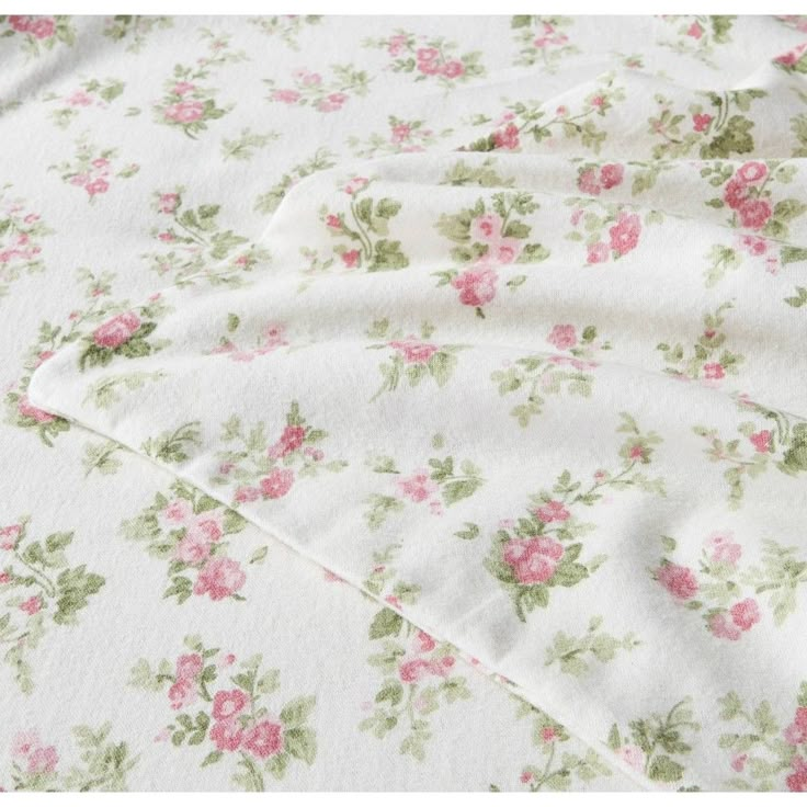 a white sheet with pink flowers on it