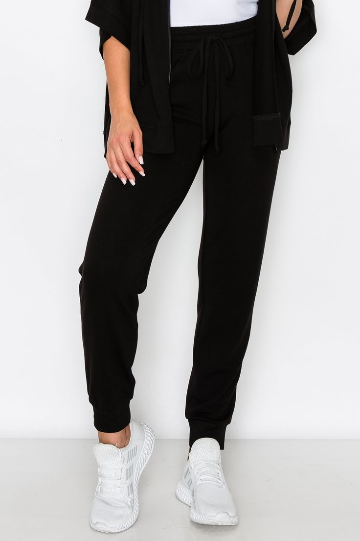 Made for active or relaxed days, these high rise relaxed joggers are the newest style added to our loungewear collection. Featuring a high-rise elasticized waistband with a drawstring detail, two pockets on each hip and cuffed hems, you’re going to love these full length loungewear joggers . High rise elasticized waistband Drawstring feature Two pockets on each hip Ultra-soft knit fabric with stretch 62% Polyester, 33% Rayon, 5% Spandex Imported Model StatsHEIGHT: 5'5" BUST: 32WAIST: 25.5HIPS: 3 Athleisure Joggers With Elastic Waistband, Relaxed Fit Drawstring Sweatpants For Lounging, Lounging Sweatpants With Drawstring And Relaxed Fit, Comfortable Loungewear Activewear With Drawstring, Solid Color Drawstring Sweatpants For Loungewear, Sportswear Joggers With Elastic Waistband For Loungewear, Relaxed Fit Drawstring Joggers For Loungewear, Athleisure Joggers With Elastic Waistband For Loungewear, Drawstring Sportswear Activewear