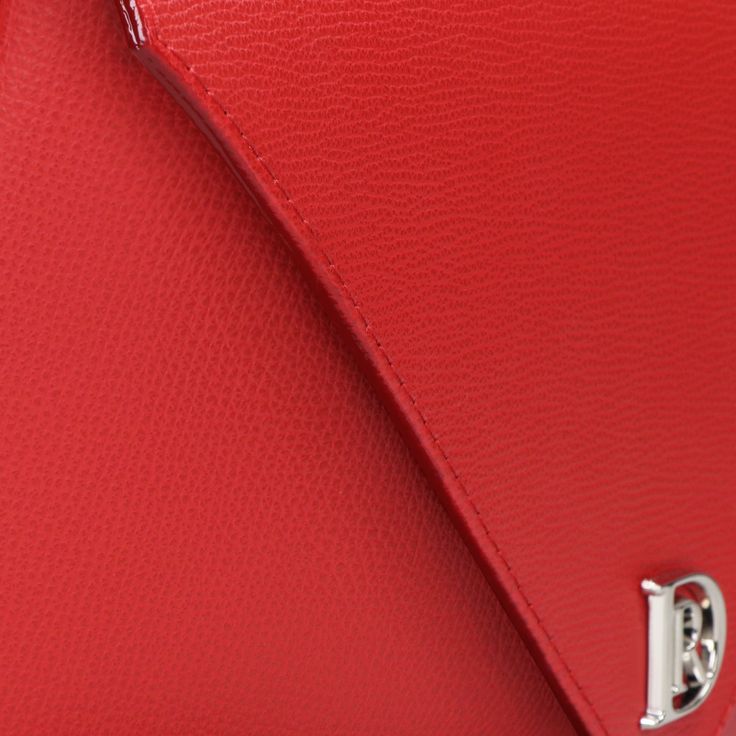 Make a bold statement with this vibrant red handbag, highlighted by luxurious gold hardware. Crafted from premium leather, it features a spacious interior with a zip pocket for organized storage. The detachable chain and leather strap offer versatile carrying options, making it an ideal accessory for the empowered, stylish woman. Red Business Bags With Silver-tone Hardware, Red Business Bag With Silver-tone Hardware, Luxury Red Flap Bag For Daily Use, Designer Red Flap Bag For Daily Use, Luxury Red Flap Bag With Removable Pouch, Designer Red Pouch Satchel, Designer Red Flap Bag For Evening, Red Formal Clutch Flap Bag, Red Evening Flap Bag With Detachable Handle