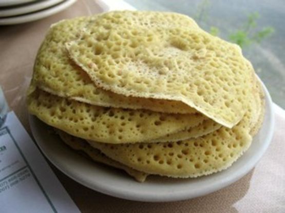 three pieces of flat bread on a white plate