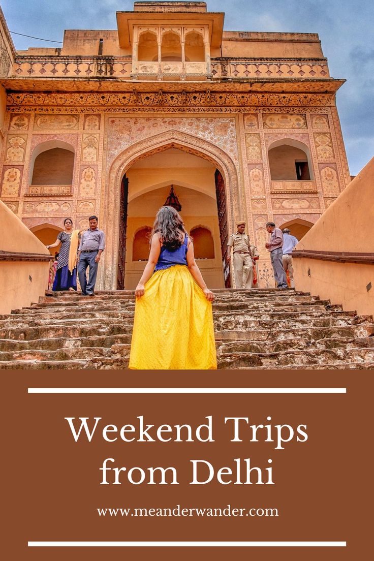 a woman in a yellow dress standing on steps with the words weekend trips from delhi