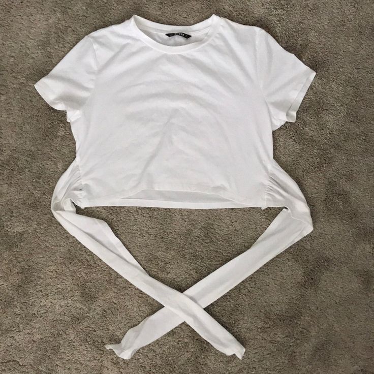 Almost Brand New White Cropped T-Shirt With A Tie Hem! This Shirt Sleeved Crop Top Has Long Pieces Of Fabric (24 Inches Lying Flat) To Wrap Around The Waist. I’m 5’5” And It Hit Perfectly At The Waist. White Stretch Crop Top T-shirt, Trendy White Stretch Shirt, White Stretch Cropped T-shirt, White Crew Neck Cropped Shirt For Summer, Summer Stretch Cropped Shirt With Crew Neck, Fitted Cotton Crop Top Shirt, Basic Fitted White Cropped Shirt, Trendy White Crop Top Shirt, Trendy White Stretch Cropped Shirt