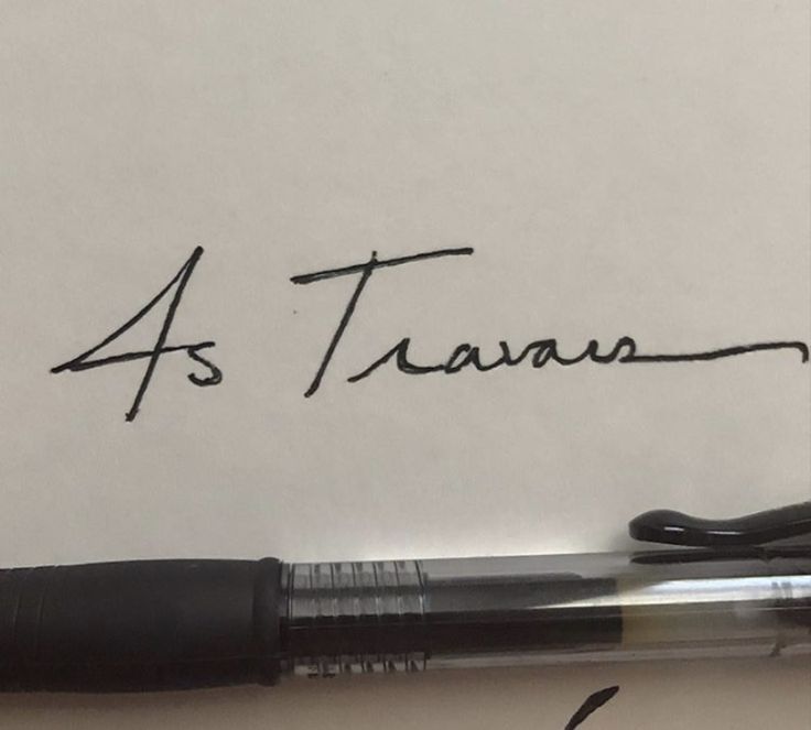 a pen is sitting on top of a piece of paper with the word 4s tarara written in cursive ink