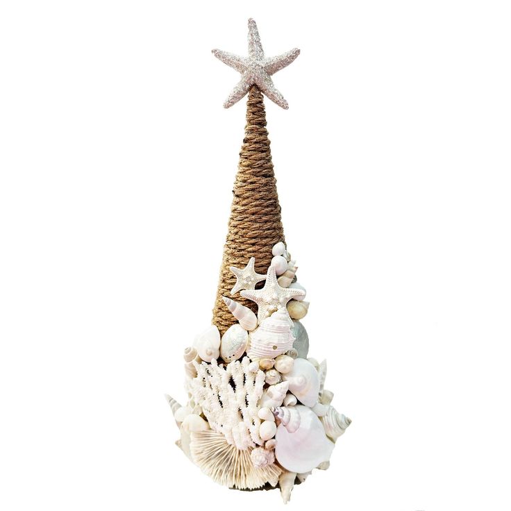 a christmas tree made out of seashells and starfish on a white background