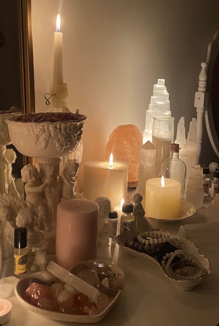 a table topped with candles and other items