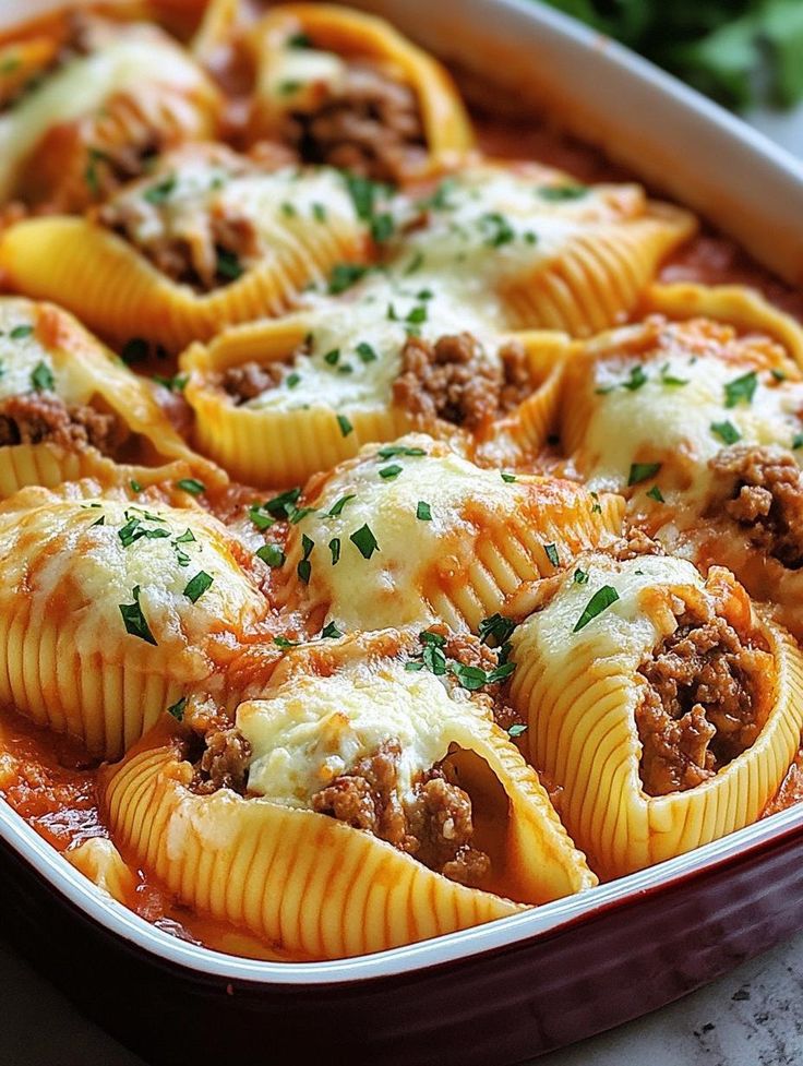 a casserole dish filled with meat and cheese