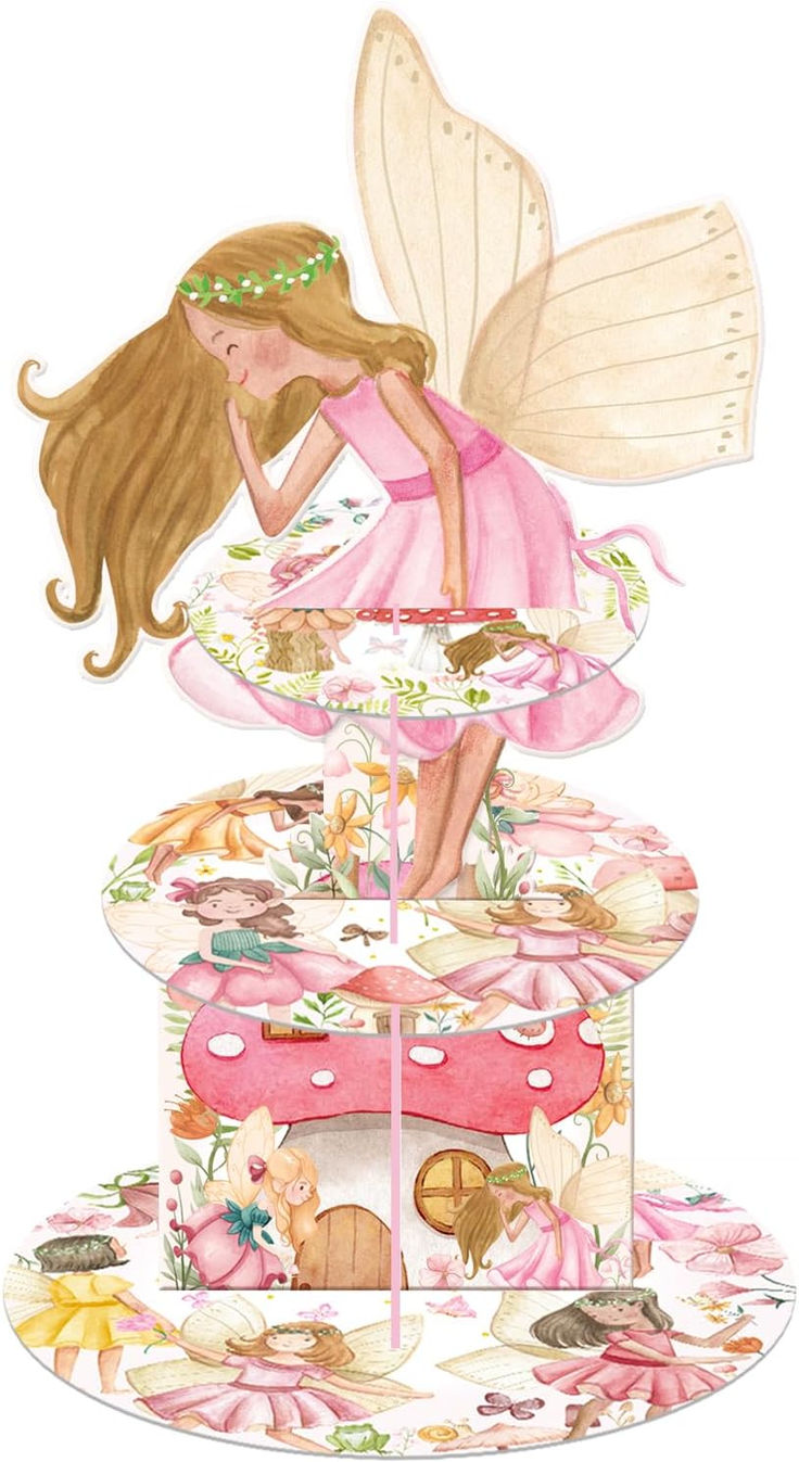 a card with a fairy sitting on top of a cake