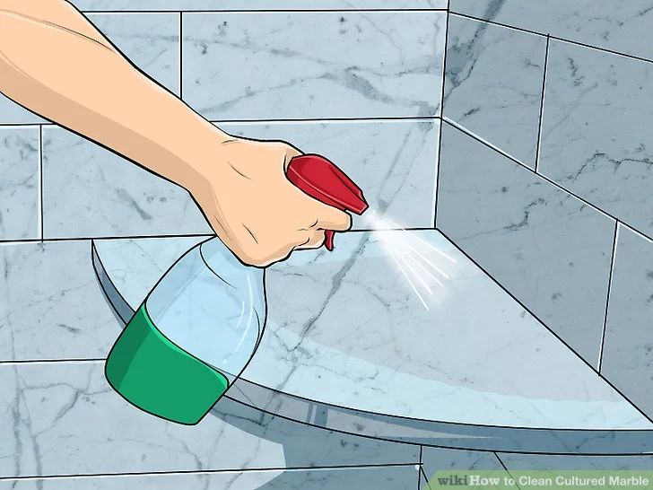 a person is cleaning a toilet with a red brush and soap dispenser