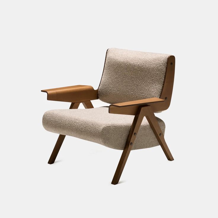 an upholstered chair with wooden legs and arm rests on a white background,