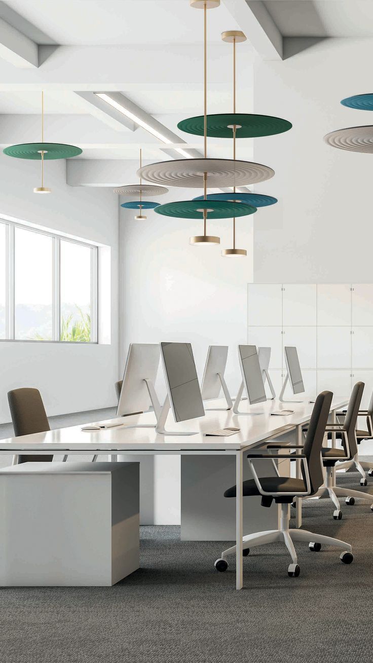 an empty conference room with chairs and desks