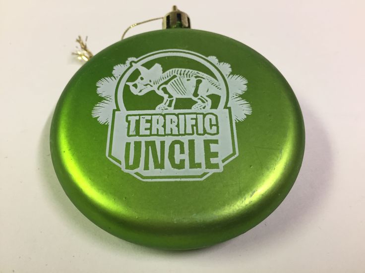 a green badge with the words terrible uncle on it