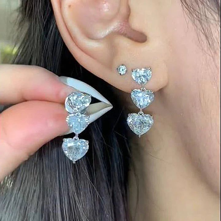 SKU#: JU177ER Earrings InformationMetal: 925 Sterling Silverplating Color: Silver ToneBacking: Push Backing Primary Stone InformationStone Type: Lab-Created GemstoneStone Cut: Heart CutStone Color: WhiteStone Size: 4.0mm. 5.0mm. 6.0mmStone Carat Weight: 7.0 CT.Stone Setting: 3 Prong *All stone weights (CT.) are approximate and listed as diamond equivalent weight in carats. Also total weight of the Earrings. Earrings width & thickness may have a slight deviation no more than 5%. *Photos may be en Rings Fancy, Rings Unique, Womens Earrings Studs, Sterling Silver Drop Earrings, Jewelry Wedding Rings, Sterling Silver Stud Earrings, Stone Setting, Silver Stud Earrings, Prom Wedding