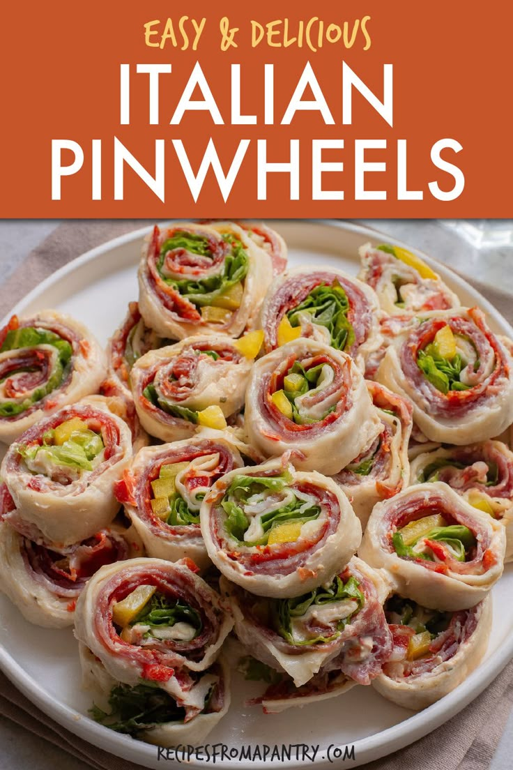 a white plate topped with rolls filled with meat and veggies