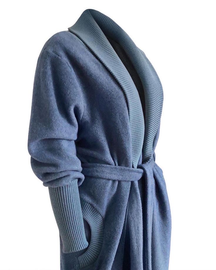 The Melange is a super warm, cozy soft dressing gown, designed with a practical ribbed sleeve, a throw-on-and-go style, great for lounging in at home. Made from 100% Organic Cotton and Merino Wool so tailored for sustainable lifestyle and contributing to a cleaner environment. Product details Fabric - 100% organic brushed fleece cotton Collar, sleeve & pocket ribbing - merino wool & acrylic Tie belt 130cm length Dry Clean recommended ( can machine 30 degrees though it won't look as silky & smooth) Model is a 5'8″ hips 40″ waist 33″ Bust 38 wearing  a S/M, we recommend  S/M size is suitable for 10 -14 size and 16 plus -M/L ( sold out on M/L) For other styles not showing on here please see my Instragram quaintrelle_luxury_loungewear and email for other styles of your interest to sales@quaint Winter V-neck Sleepwear For Lounging, Oversized Fall Robe For Loungewear, Oversized Fall Loungewear Robe, Super Soft Sleepwear For Fall, Super Soft Fall Sleepwear, Solid Color Winter Sleepwear For Lounging, Cozy Solid Color Cardigan For Loungewear, Winter Loungewear Sleepwear, Relaxed Fit Winter Robe For Loungewear