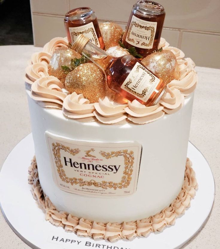 a birthday cake decorated with bottles of hennessy's happy birthday jams