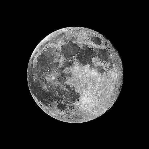 the full moon is shown in black and white