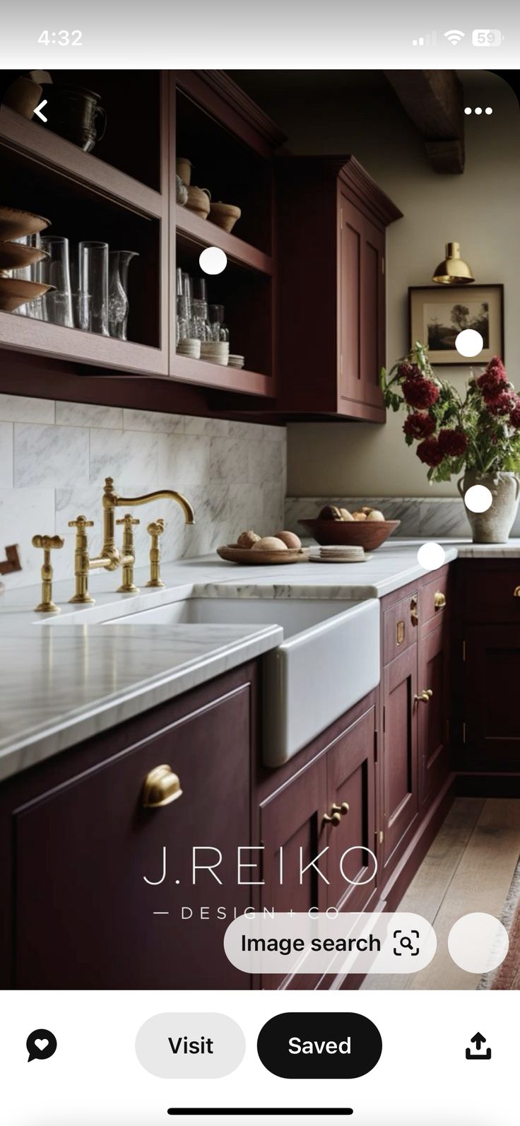 a kitchen with wooden cabinets and marble counter tops, is shown on the instagram page