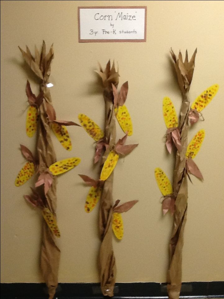 three vases made out of brown paper with yellow flowers on them and the words cary music written in white