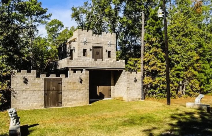 an old castle like structure in the woods