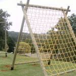 a soccer goal in the middle of a grassy field