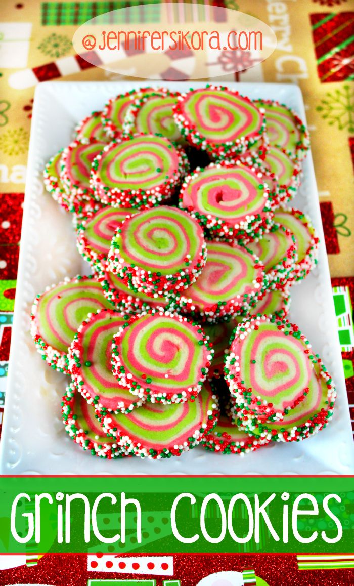 a white plate topped with green and red cookies