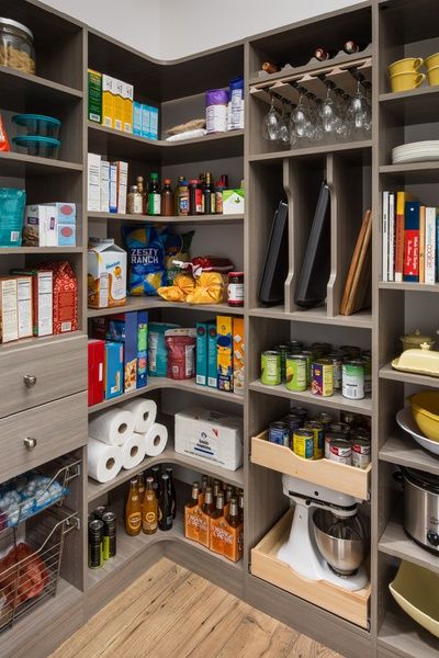 an organized pantry with lots of food and condiments on the shelves for storage