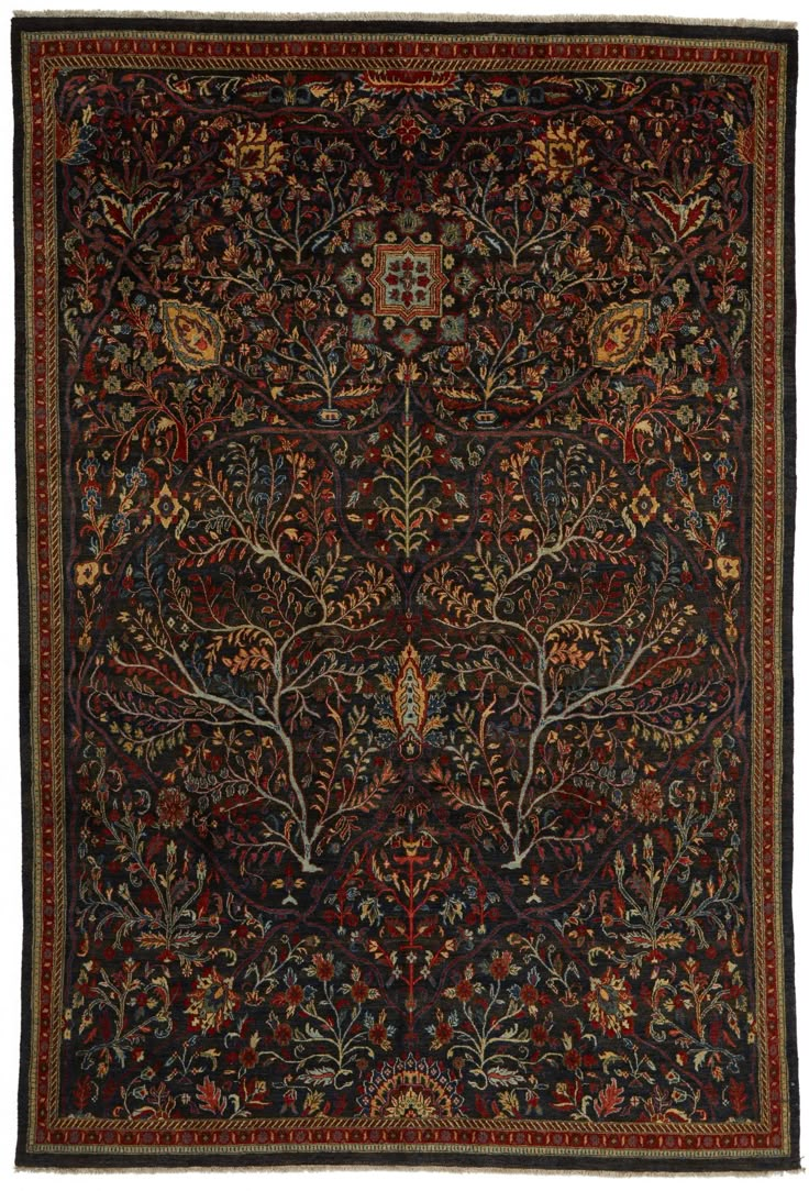 an antique rug with trees and flowers on it