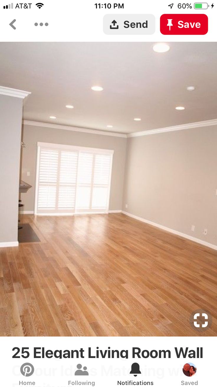 an empty living room with hard wood floors and white walls is featured on instagram