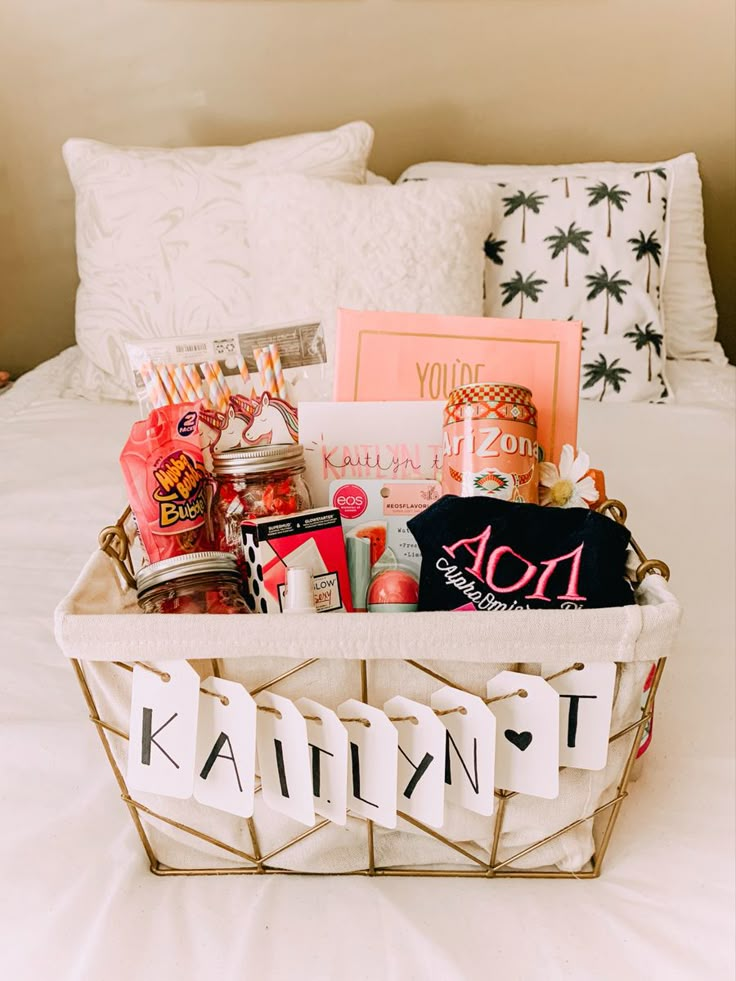 a white basket filled with personal items on top of a bed