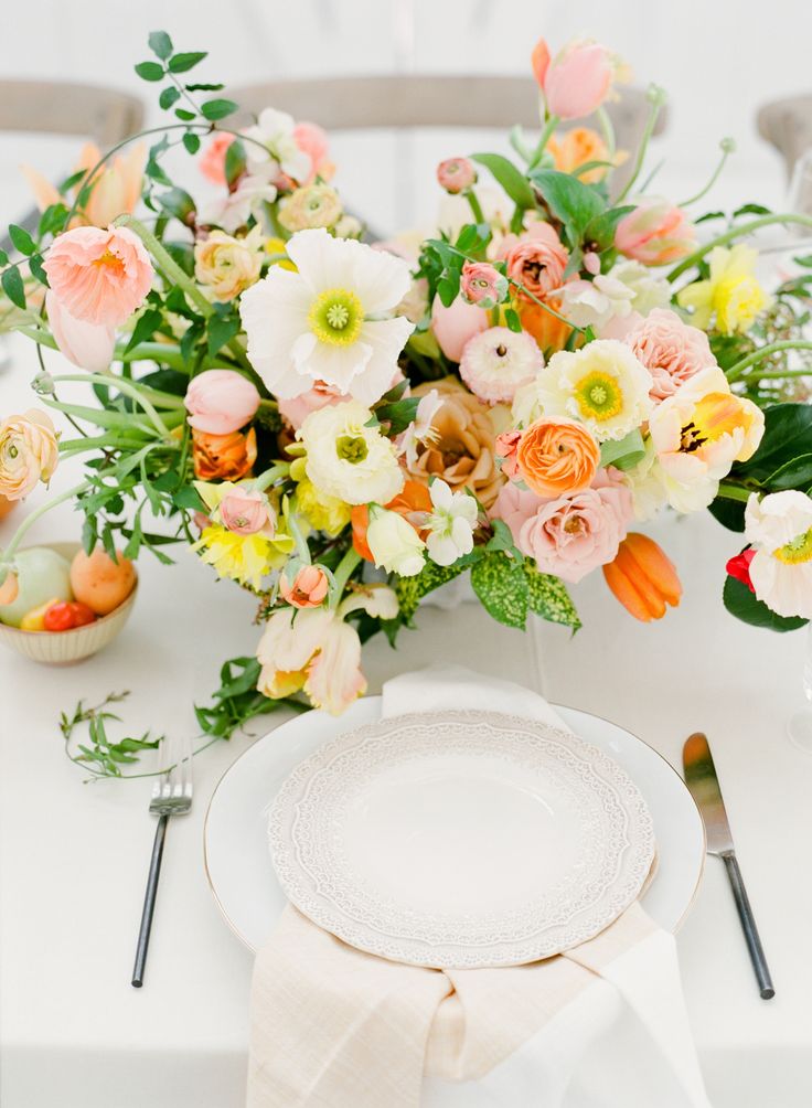 a white plate topped with a bouquet of flowers