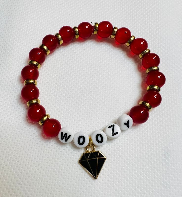 Woozy's Red Ruby themed bracelet Red Stretch Bracelet For Friendship In Trendy Style, Casual Red Charm Bracelet Gift, Trendy Red Stretch Bracelet For Friendship, Adjustable Red Bracelet With Letter Beads, Personalized Red Casual Jewelry, Red Adjustable Personalized Stretch Bracelet, Personalized Casual Red Jewelry, Personalized Red Casual Bracelet, Red Adjustable Stretch Bracelet, Personalized