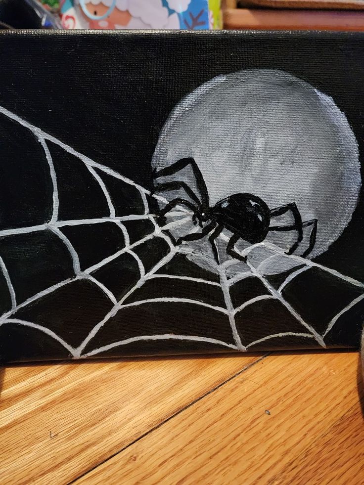 a painting of a spider in front of a full moon