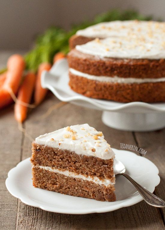 a slice of carrot cake on a white plate