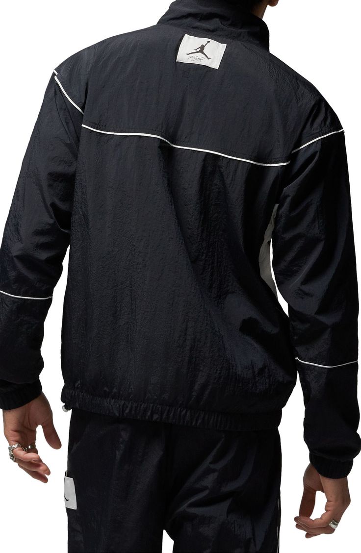 Constrast trim traces the sleek design of this lightweight warmup jacket crafted from a breathable nylon weave and outfitted with secure zip pockets. 27" length ( size Medium ) Stand collar Breathable construction allows ventilation of excess heat for cooling comfort Elastic cuffs and hem Mesh lining 100% nylon Machine wash, line dry Imported Nordstrom x Nike: A curated lifestyle destination where fashion is the ultimate sport Nylon Half-zip Sportswear Outerwear, Reflective Long Sleeve Track Jacket For Streetwear, Techwear Track Jacket With Reflective Details, Nylon Techwear Track Jacket For Sports, Black Nylon Outerwear With Elastic Cuffs, Nylon Outerwear With Elastic Cuffs, Nylon Techwear Track Jacket With Reflective Details, Streetwear Half-zip Track Jacket With Ribbed Cuffs, Nylon Windbreaker With Reflective Details