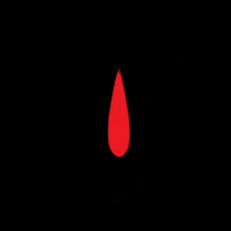 a blood drop in the dark with red light on it's side and black background