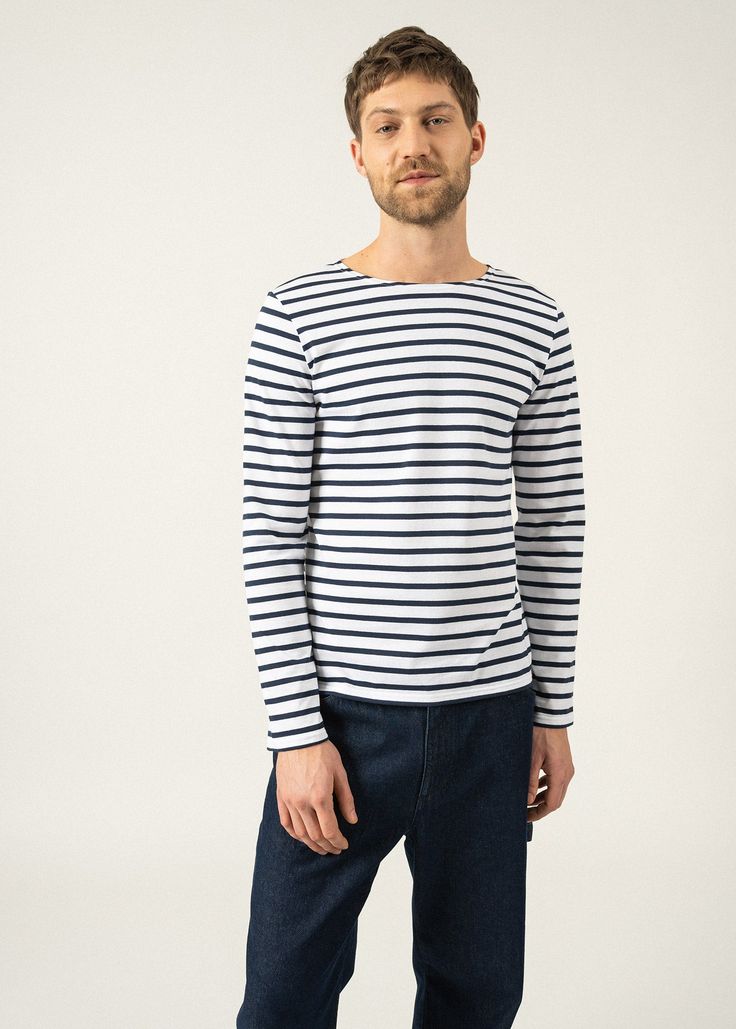 Light and versatile, the Breton striped shirt or marinière MINQUIERS MODERNE embodies a French state of mind. Its masculine straight fit around the waist and down the hips with full-length sleeves make it suitable for both men and women looking for a boyfriend fit. Please refer to the sizing guide to identify your best fit. Fashion tip: when wearing their beloved MINQUIERS MODERNE, many women like to roll up their sleeves as they are longer than average. Perfect to bring in some French girl effo Classic Striped Cotton T-shirt, Saint James Striped Shirt, Striped Breton Top, Classic Cotton T-shirt With Striped Collar, White Relaxed Fit T-shirt With Horizontal Stripes, Breton Stripe Shirt, Merchant Navy, Men Fits, Boyfriend Fit