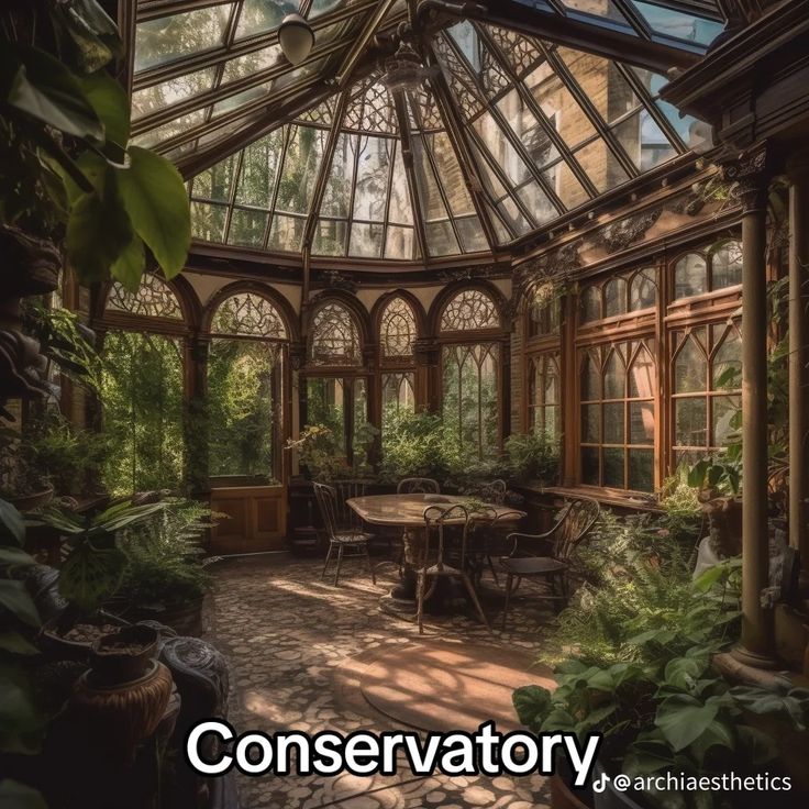 the inside of a building with lots of windows and plants in it that reads conservatory