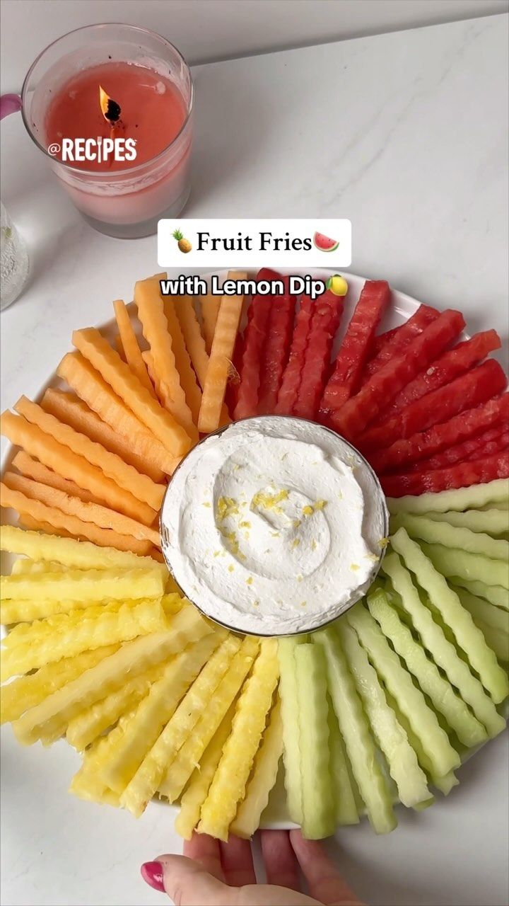 the fruit fries with lemon dip are arranged in a circle on top of a white plate