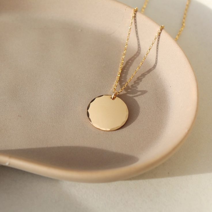 Coin Necklace - Token Jewelry - Eau Claire Jewelry Store - Local Jewelry - Jewelry Gift - Women's Fashion - Handmade jewelry - Sterling Silver Jewelry - Gold filled jewelry - Jewelry store near me Everyday Hammered Medallion Jewelry, 14k Gold Hammered Round Pendant Jewelry, Everyday Hammered Round Disc Jewelry, Everyday 14k Gold Medallion Charm Necklace, Hammered 14k Gold Round Disc Jewelry, 14k Gold Hammered Round Disc Jewelry, Hammered Round Coin Necklace, Hammered Medallion Jewelry For Anniversary, Tarnish Resistant Yellow Gold Round Disc Charm Necklace