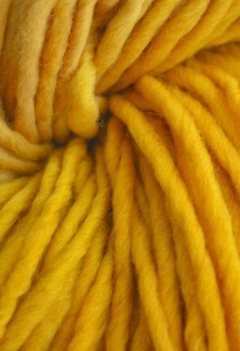 yellow yarn is shown in close up view